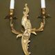 Pair of antique French wall sconces, gilded and bronzed, from the 1920s.