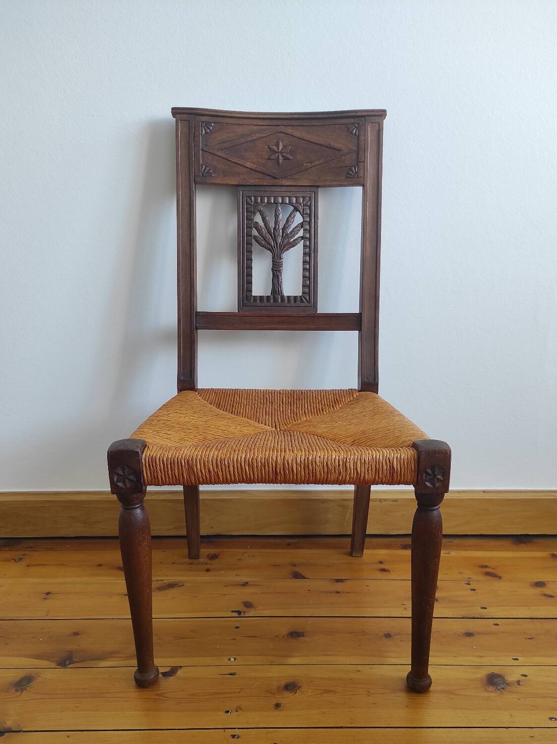 Armchair, low carved chair from the 19th century - decorated with wheat ears.