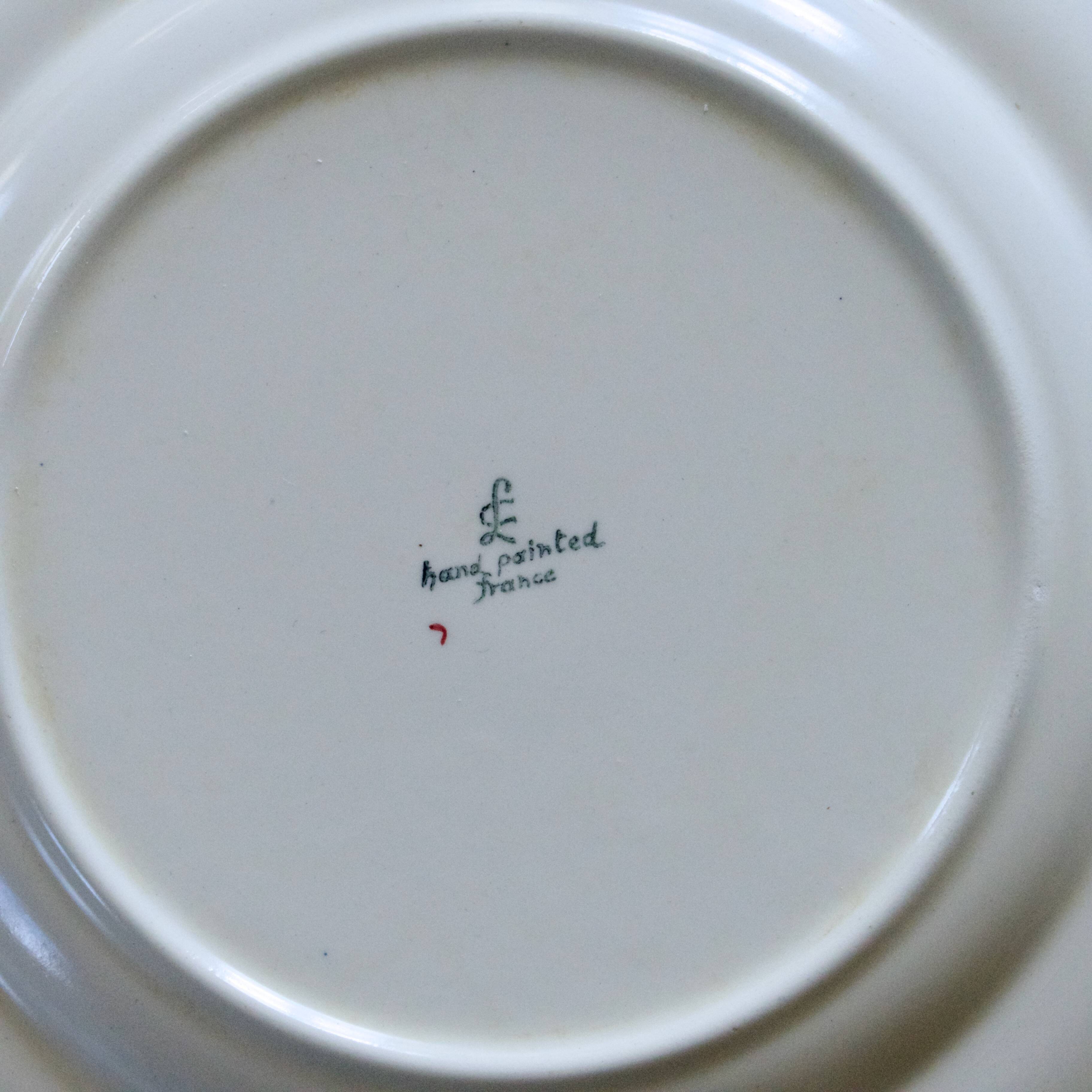 10 flat plates from the Longchamp "Nemours" collection, hand-painted.