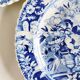 Five 19th century Calais earthenware plates with a romantic gallant couple decor