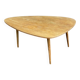 Scandinavian coffee table in the shape of a pebble/bean made of light solid wood from the years.