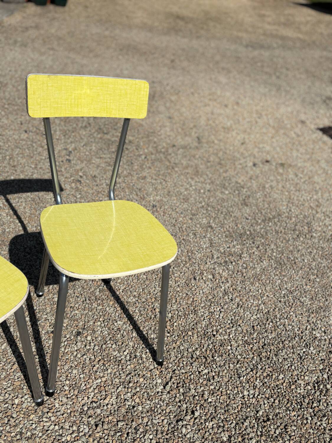 Pair of yellow Formica chairs