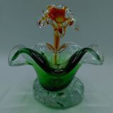 Cup has blown glass jewelry