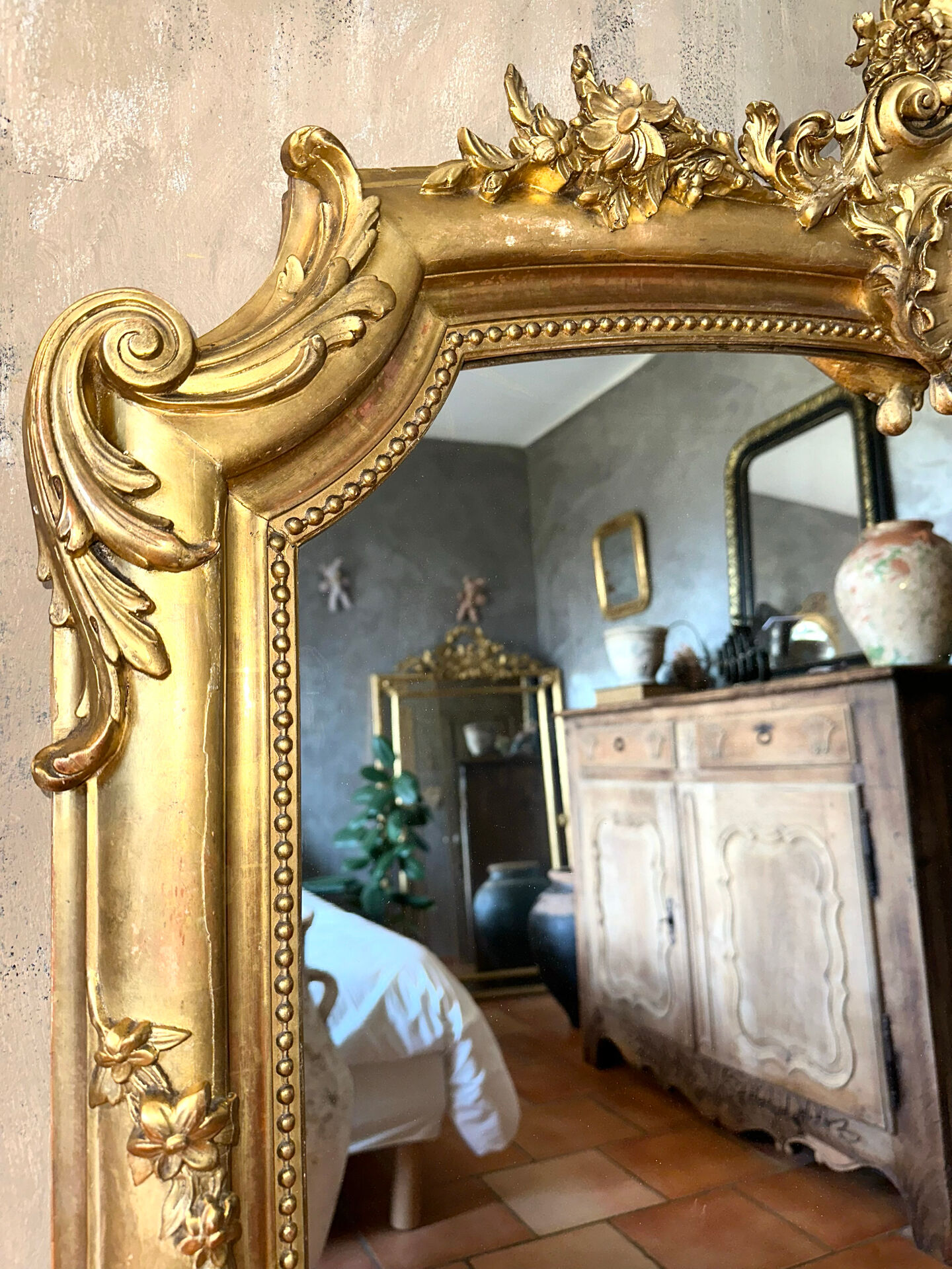 19th-century gilded antique pediment mirror