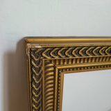 Frame with channels in wood and gilded stucco
