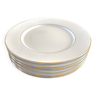 Assiettes plates en porcelaine blanches et dorées