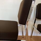 Pair of brown low chairs with chrome base