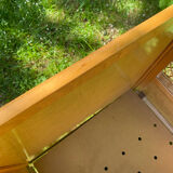 Vintage wooden and rattan baby cot from the 1960s.