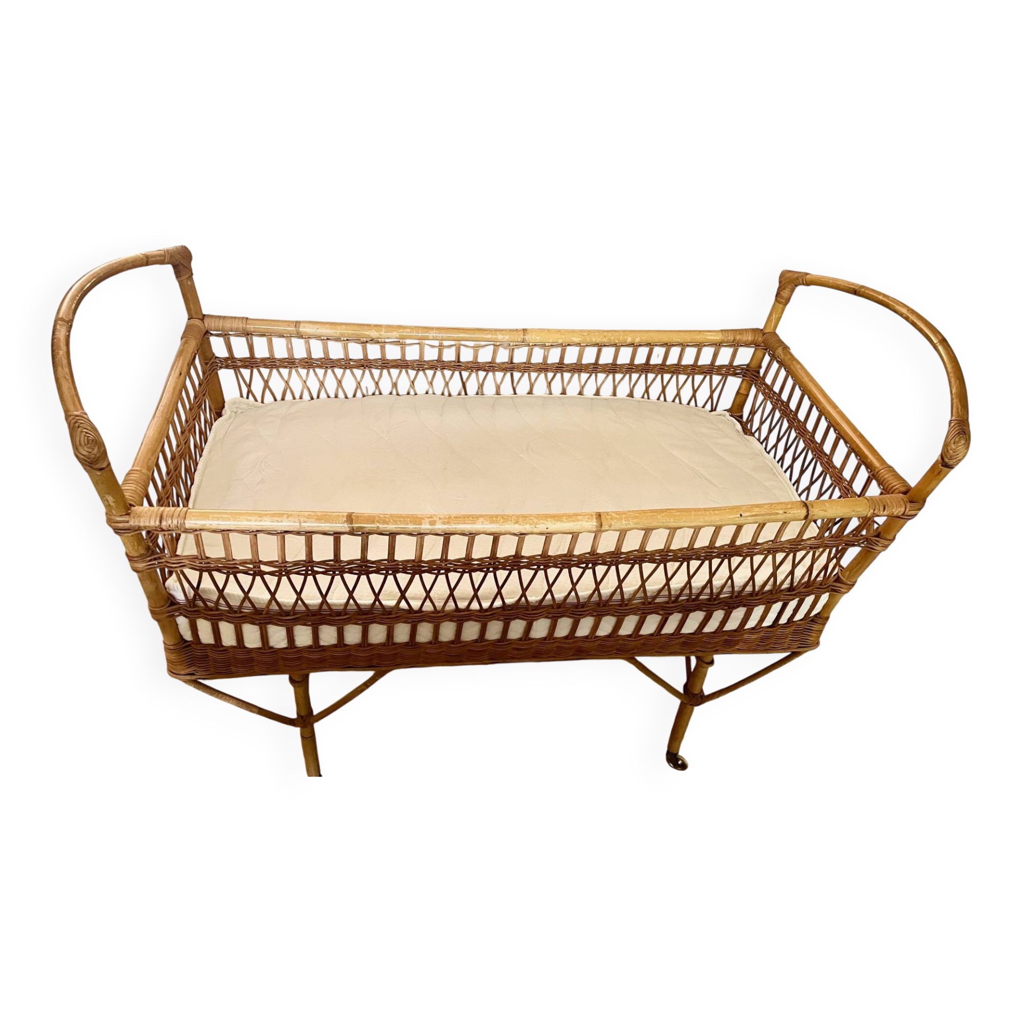 Vintage rattan baby bed with wheels
