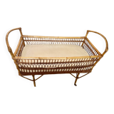 Vintage rattan baby bed with wheels