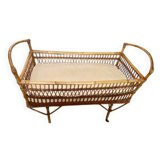 Vintage rattan baby bed with wheels