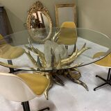 Round glass and brass table by designers Richard and Isabelle Faure