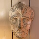 Plaster face wall statue