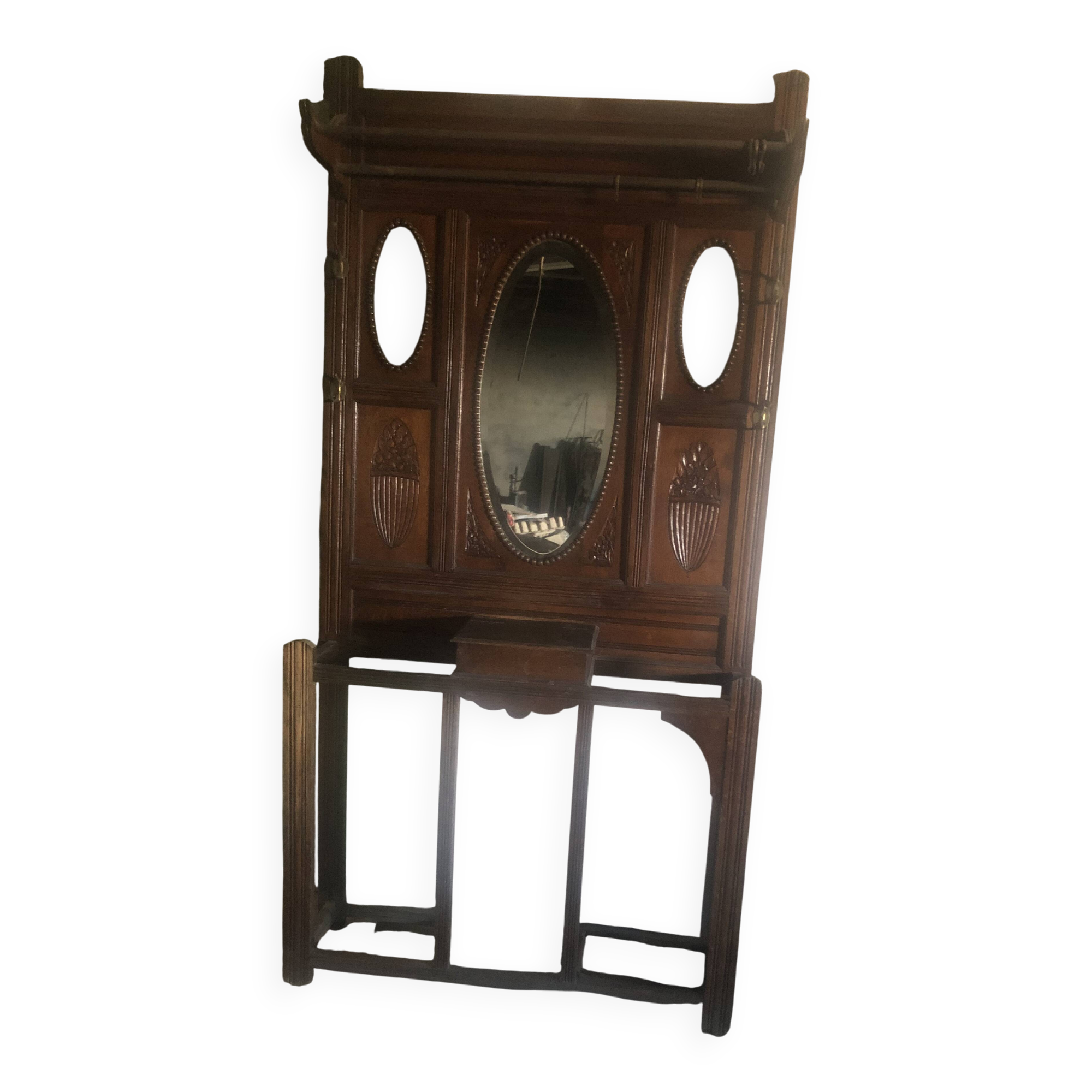 Very decorative coat rack with bevelled mirror.