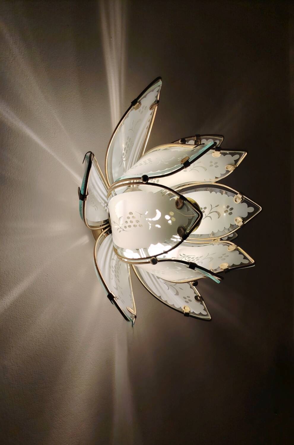 Lotus flower wall sconce in glass with a gold brass rim