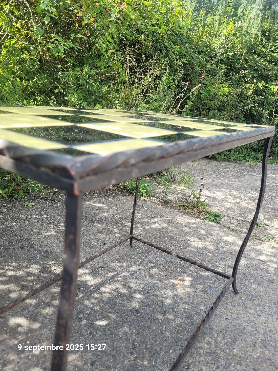 Coffee table with tiled and wrought iron finish