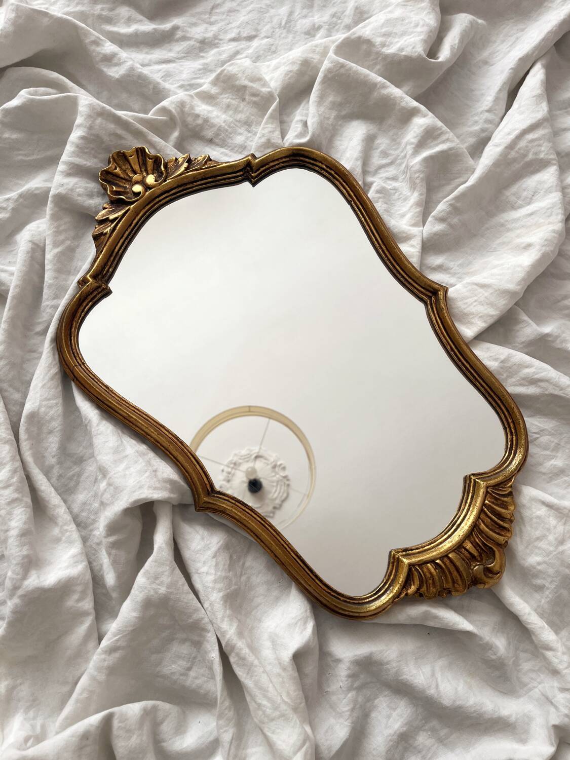 Antique Louis XV gilded mirror with vintage rocaille shell
