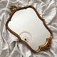 Antique Louis XV gilded mirror with vintage rocaille shell