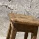 Pair of vintage wooden workshop stools with a patina.