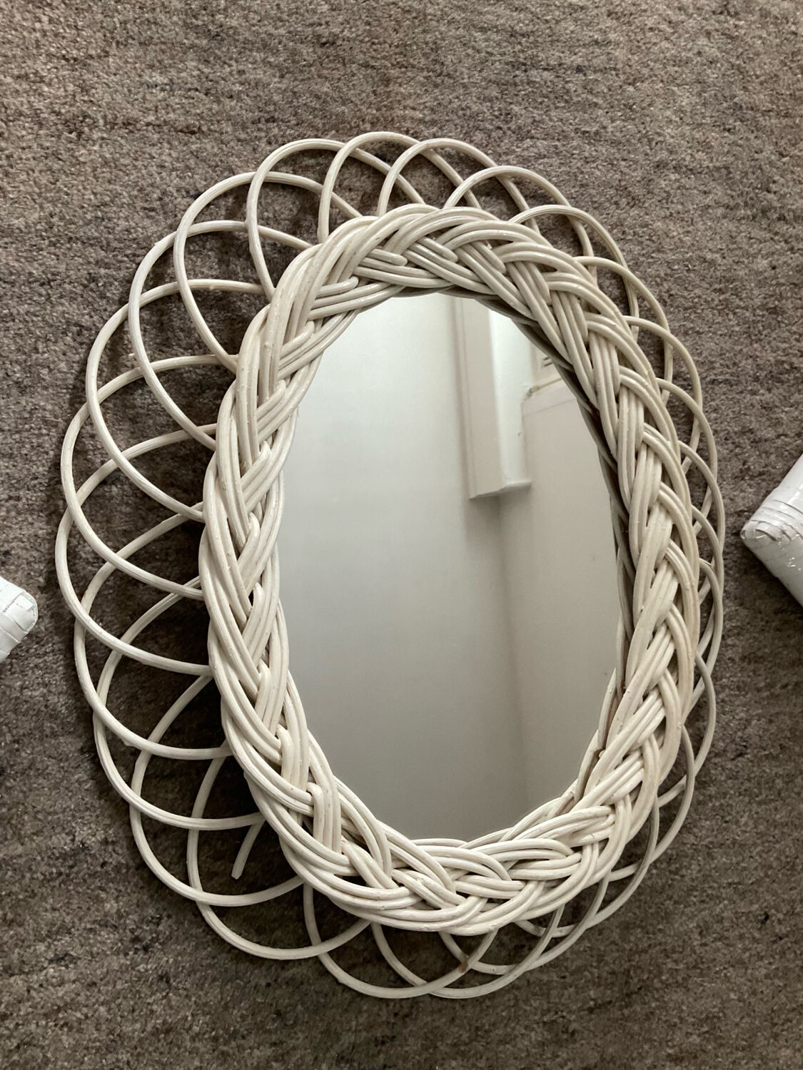 Rattan entrance set with mirror and 2 coat hooks.