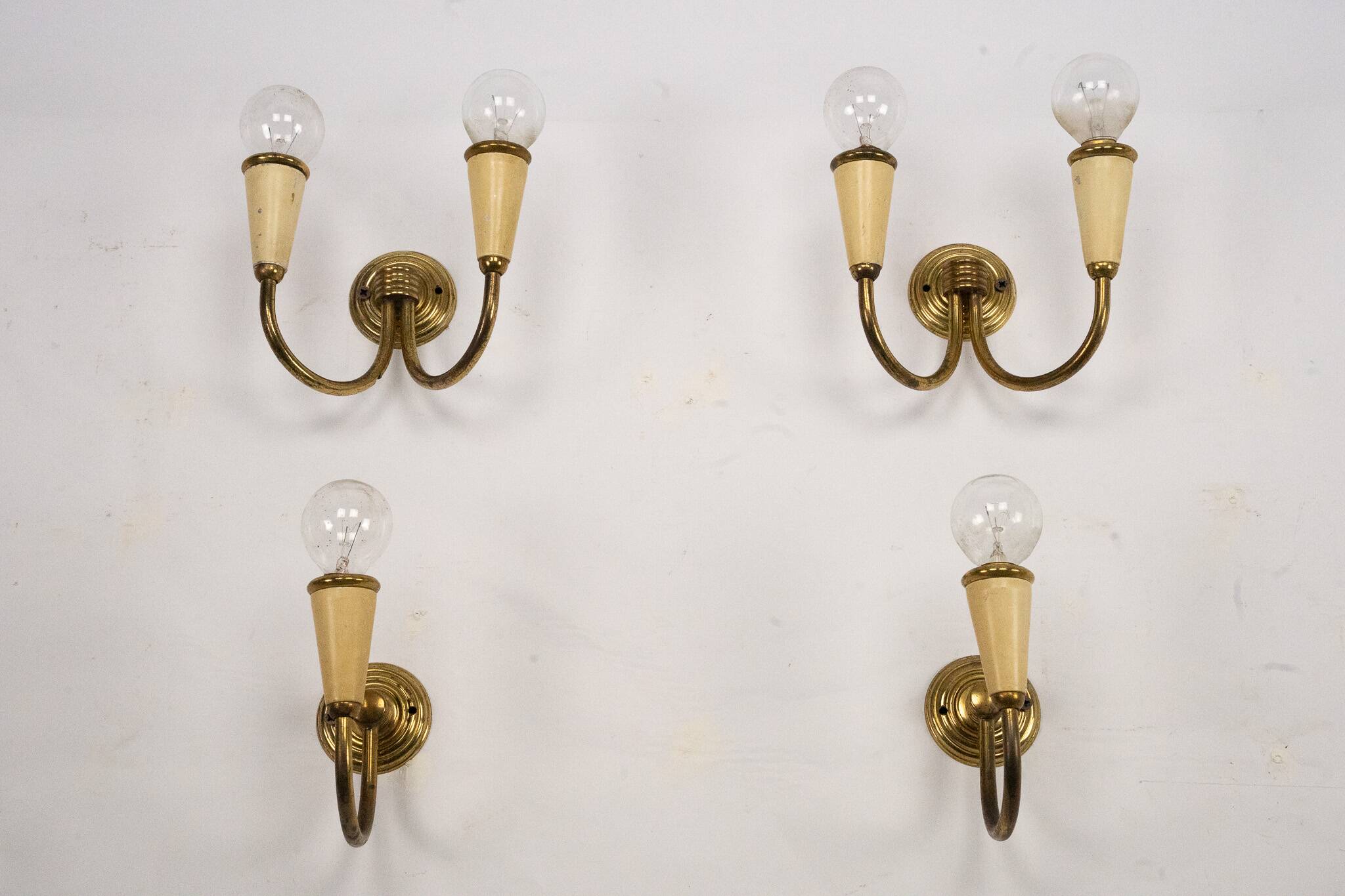 Set of four Mid-Century sconces in lacquer and brass. Italy 1950s