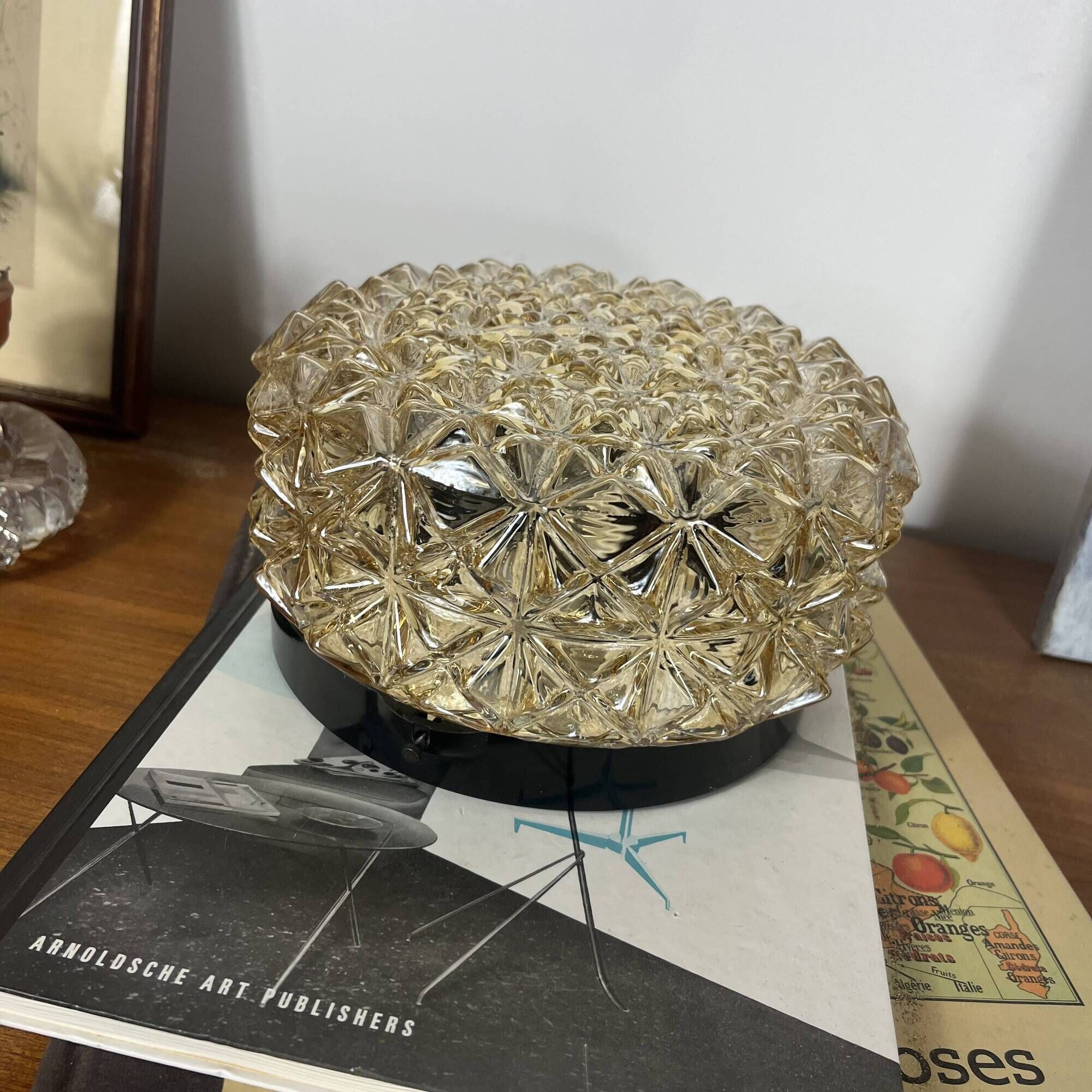 Vintage 1970s round wall light ceiling fixture with amber glass and gold.