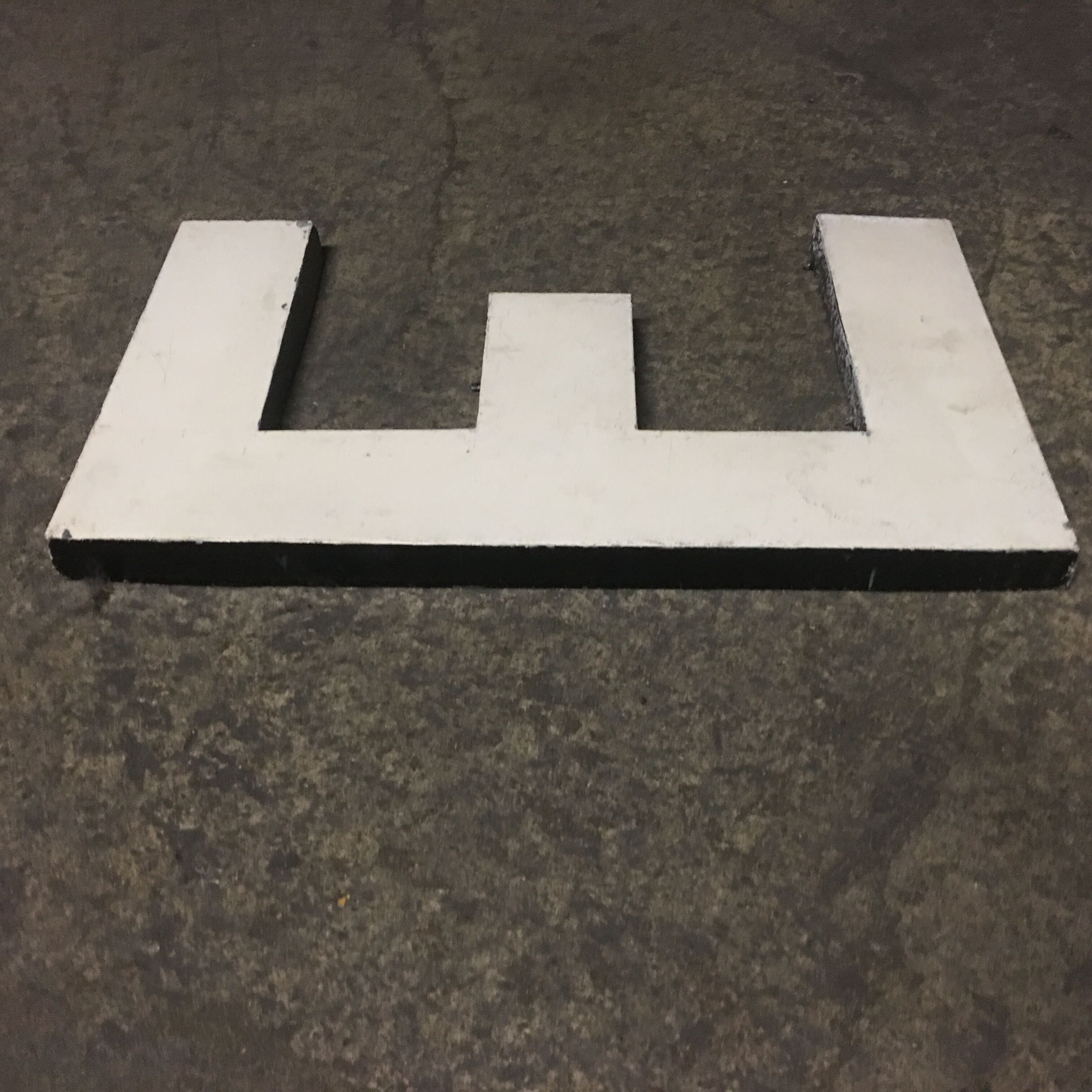 Letter e in old zinc