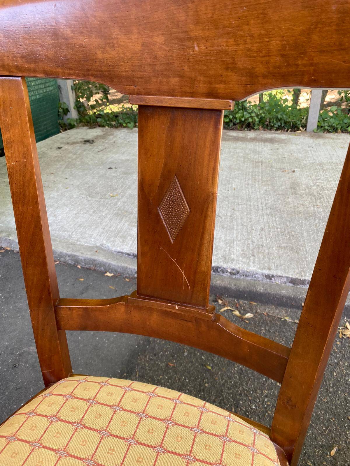 6 Syriel solid cherry wood dining chairs with yellow fabric.