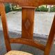 6 Syriel solid cherry wood dining chairs with yellow fabric.