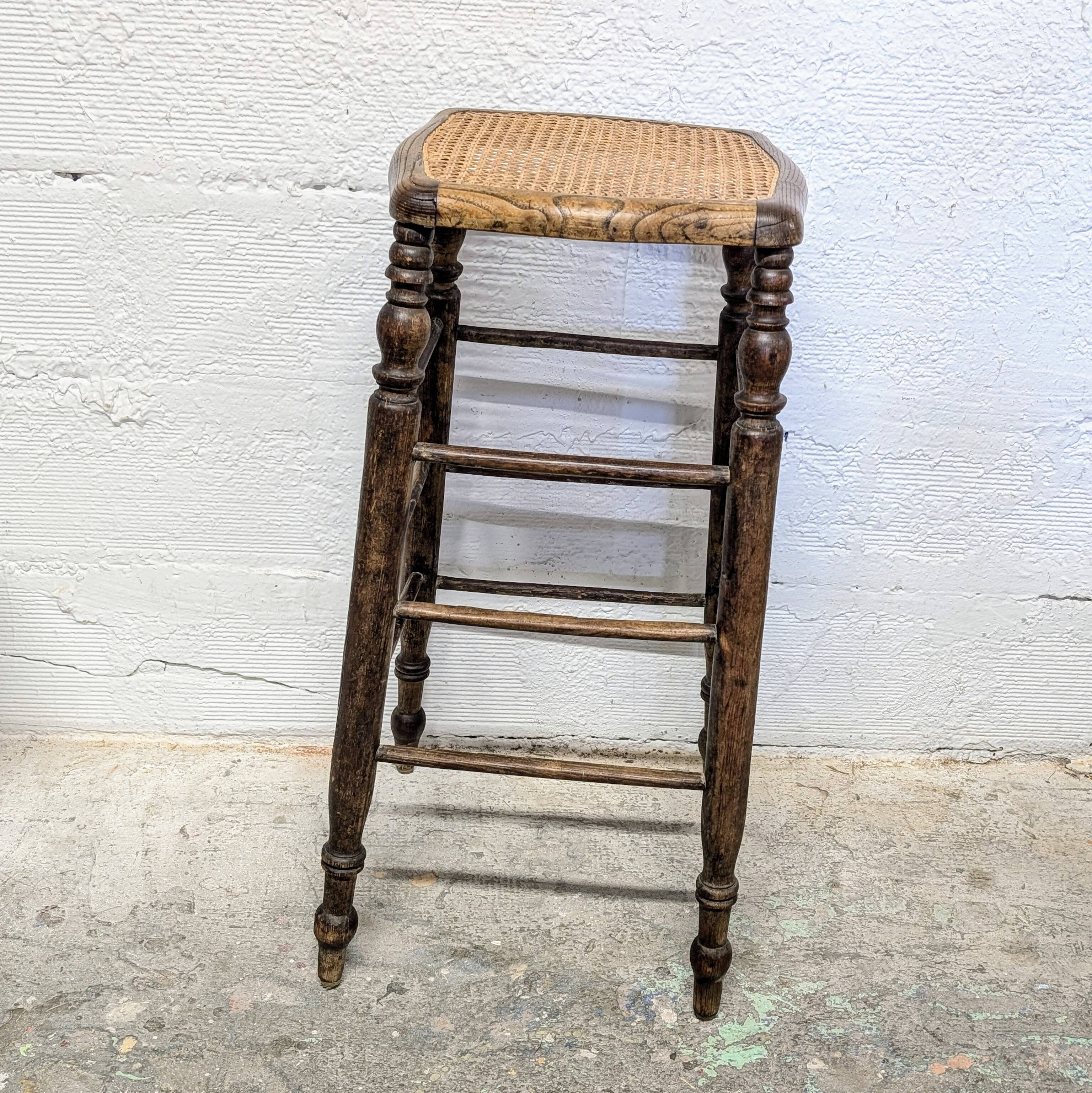 High stool with cane seat