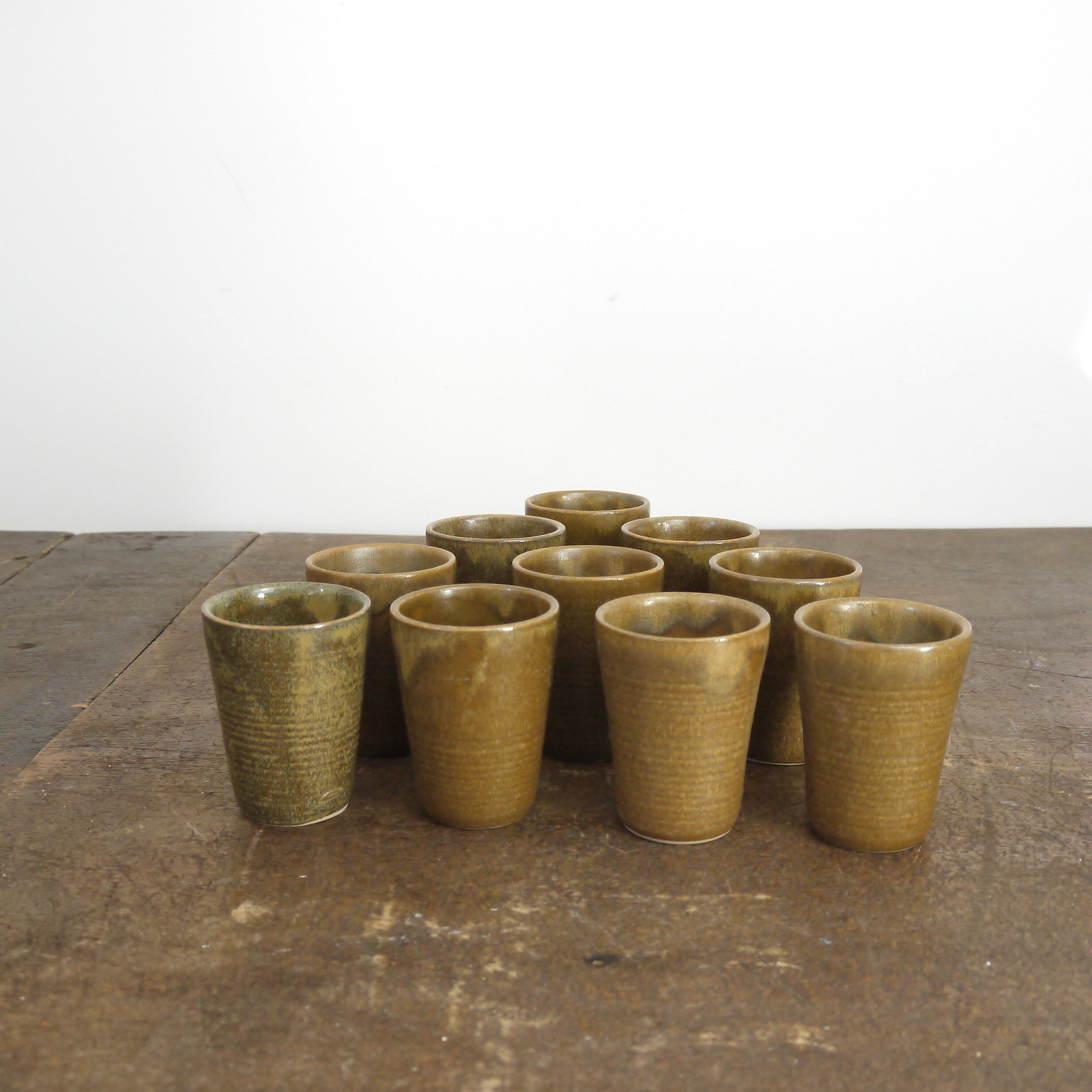 Lot of ten cups of Digoin sandstone