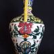 Art Deco ceramic vase with brightly colored abstract patterns