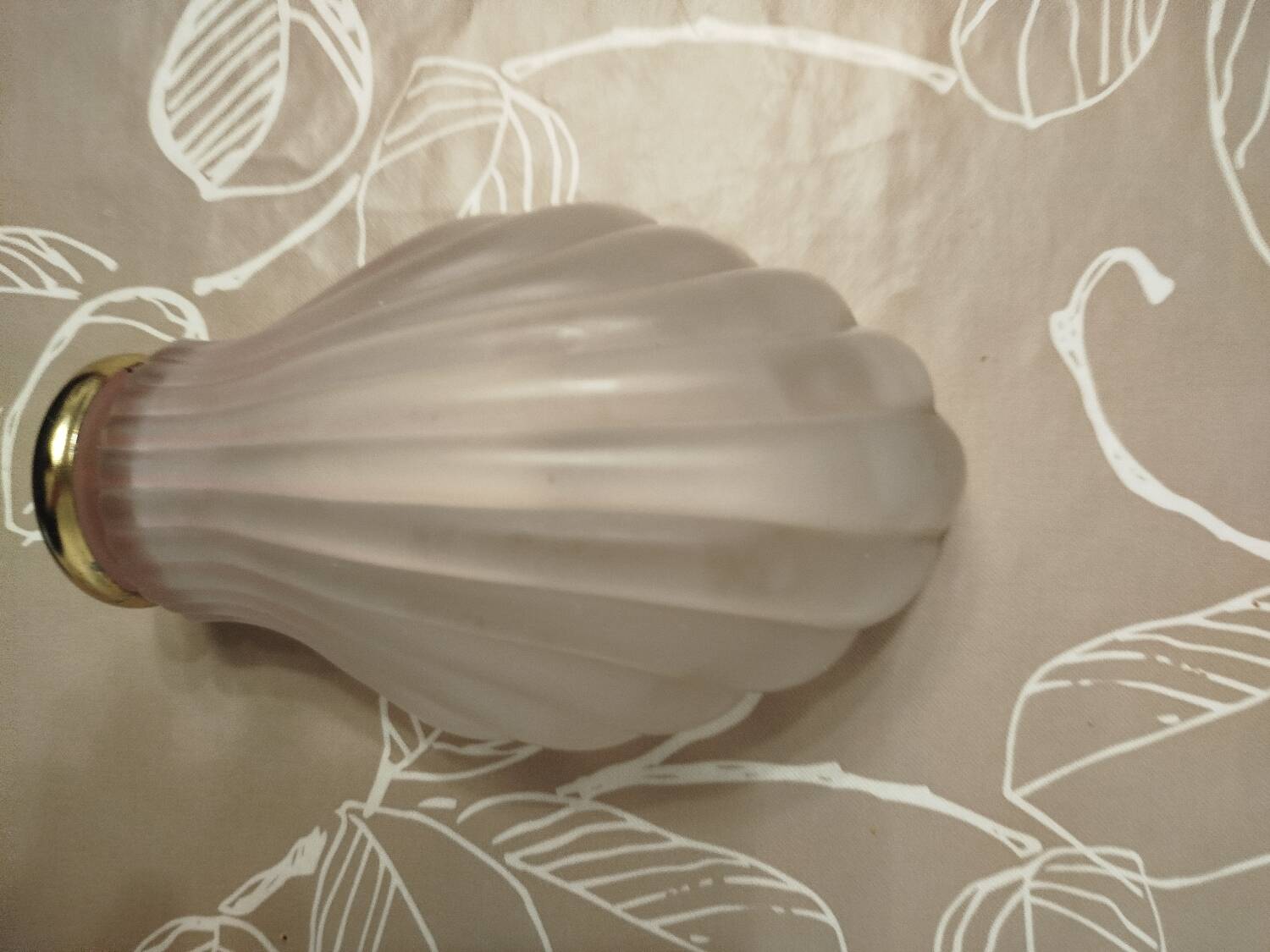 Art Deco wall sconce in frosted pink glass with a seashell design