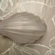 Art Deco wall sconce in frosted pink glass with a seashell design