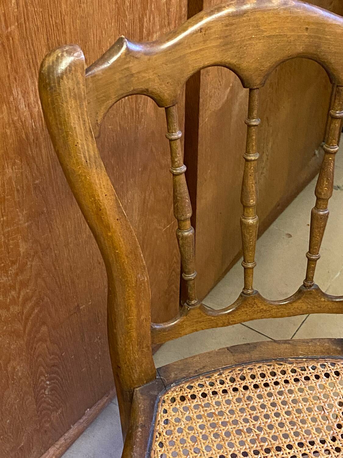 Antique wooden chair, cane seat