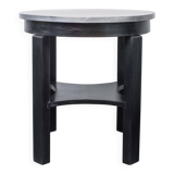 Round Art Deco black painted wooden side table with lower shelf, 1930s.