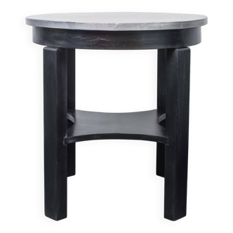 Round Art Deco black painted wooden side table with lower shelf, 1930s.