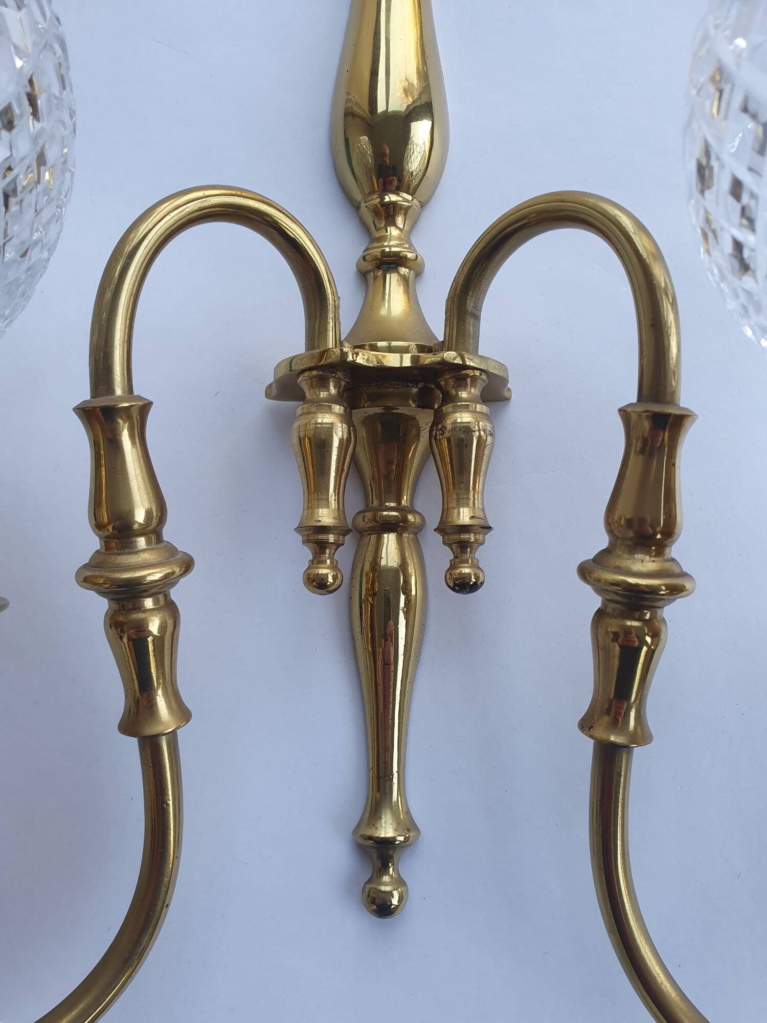 Two-light wall light gold with antique crystal globes