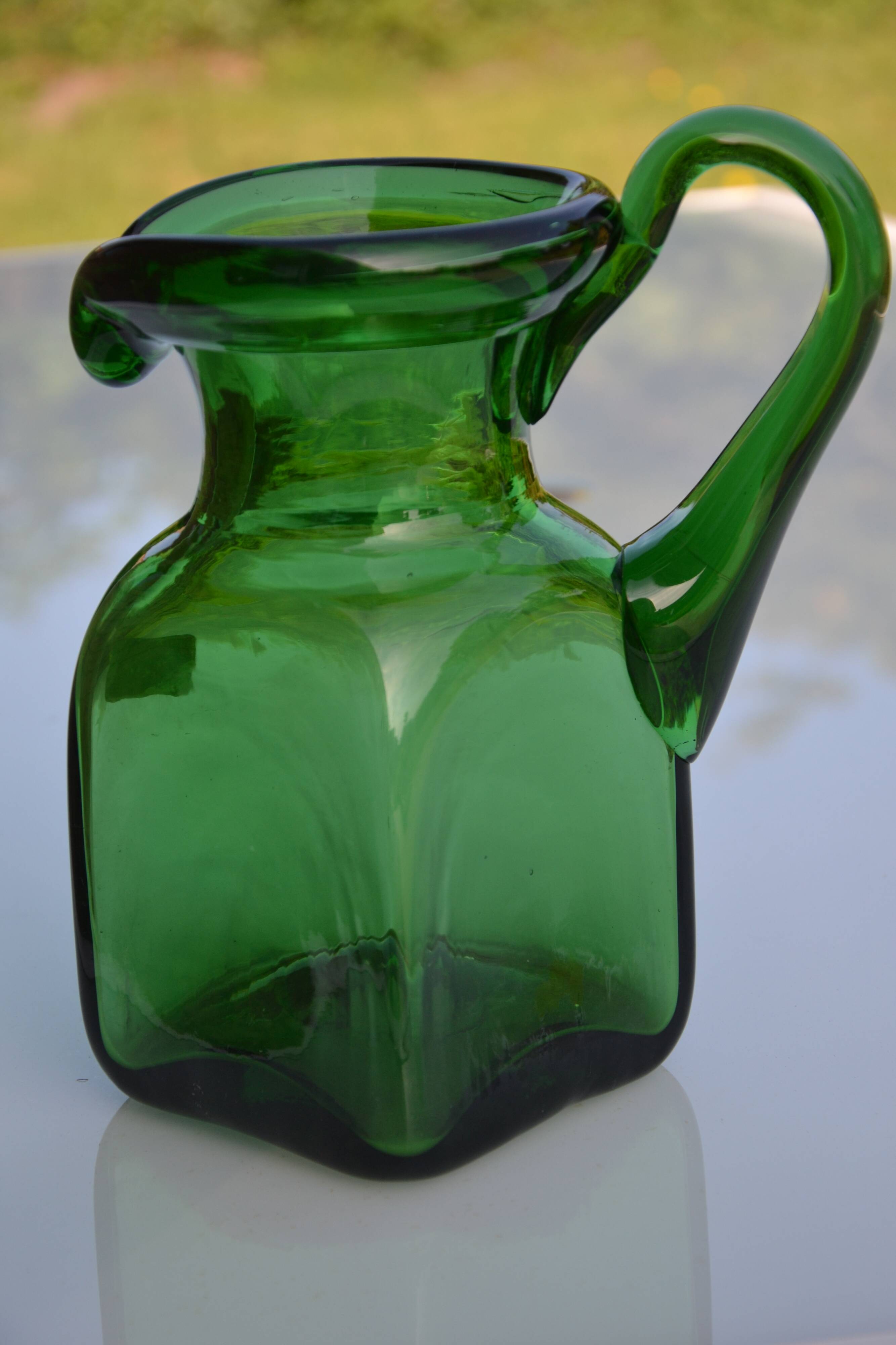 Handcrafted green glass pitcher from Spain