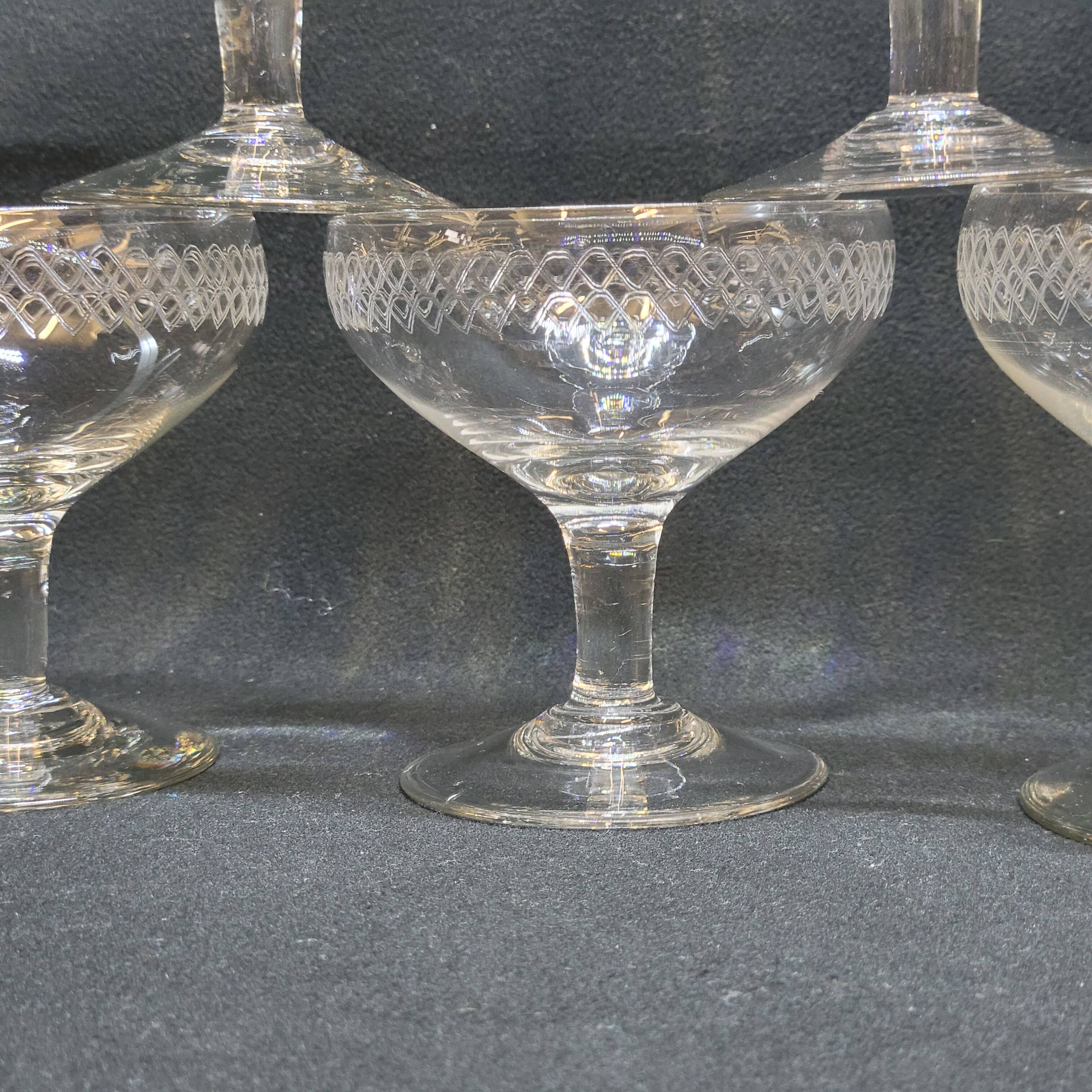 12 old champagne glasses in blown and engraved glass