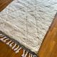 Berber carpet blessed white ouarain patterns with reliefs and black finishes