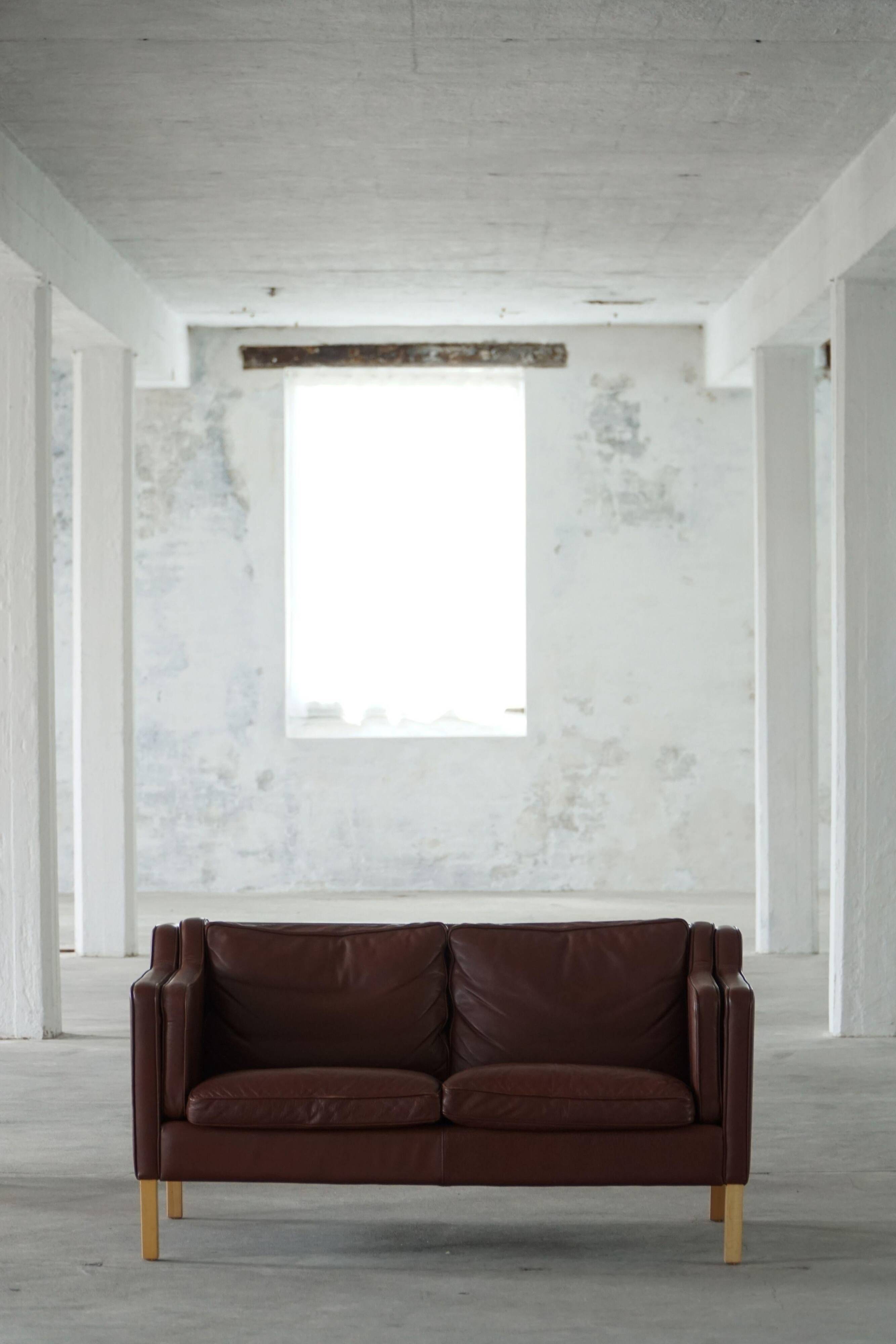 Stouby Møbelfabrik, two-seater sofa in mid-century style in brown leather, 1970s.