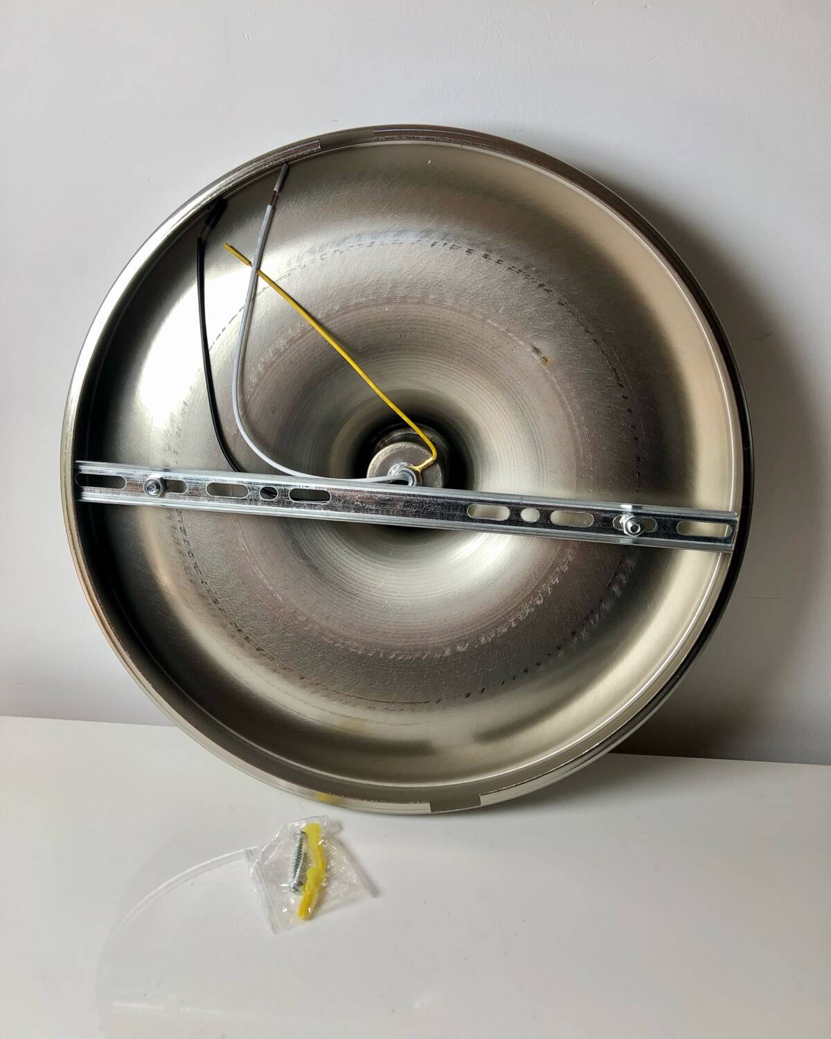 Modernist disc wall sconce