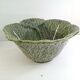 Vintage salad bowl in dabbling cabbage leaf and cutlery