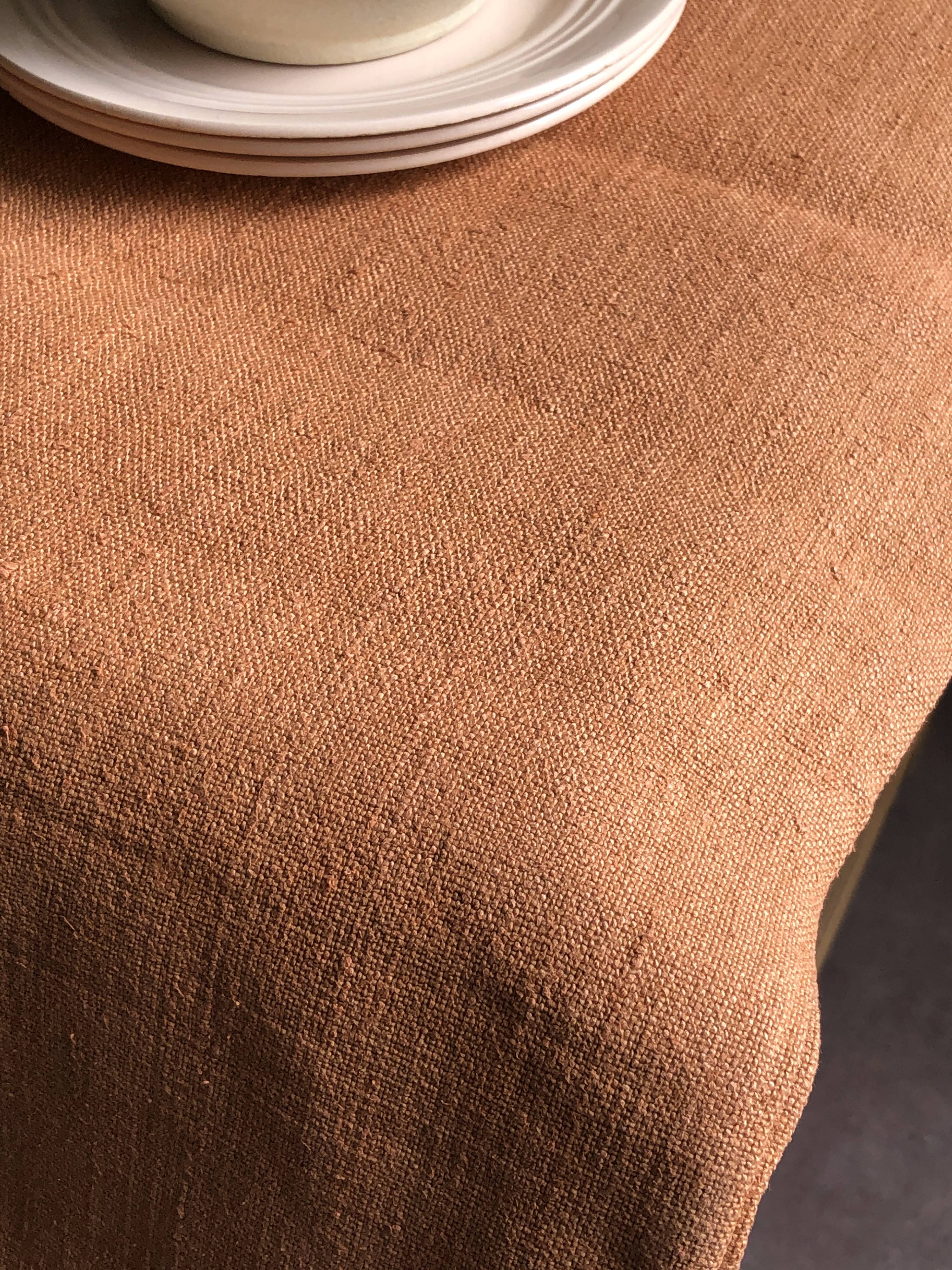 Old harvest tablecloth in terracotta tinted hemp
