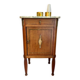 Antique bedside table in wood and marble – adorned with gilded brass ornaments –