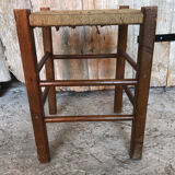 Wooden stool with woven rope seat