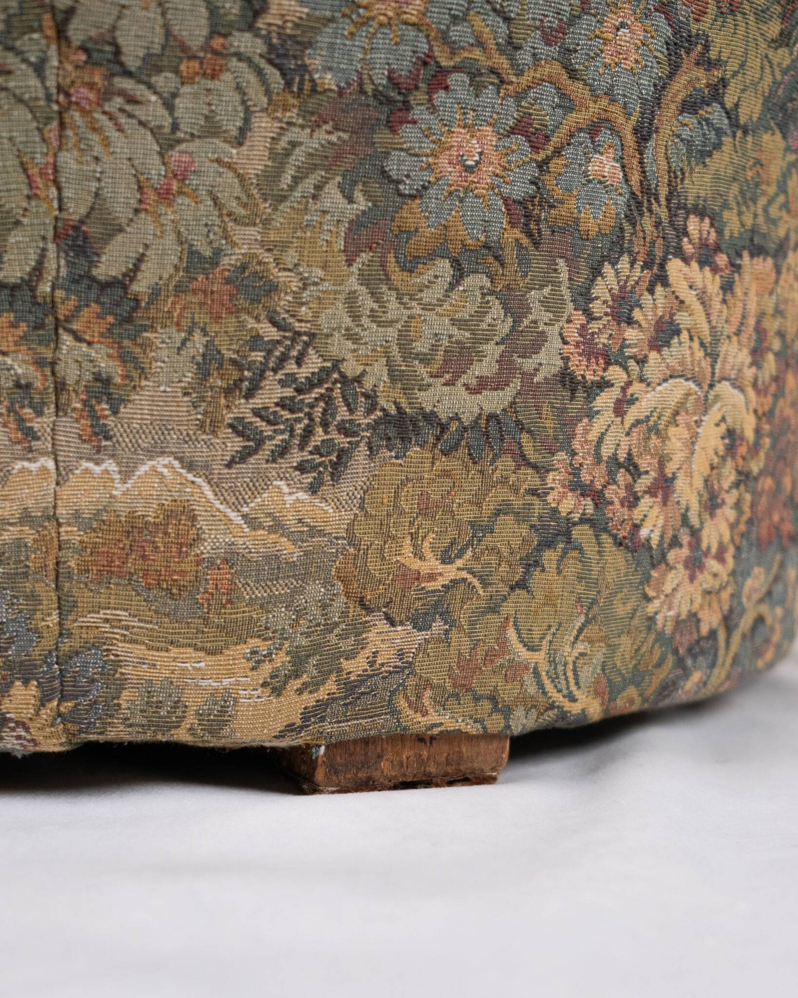 Upholstered pouf in verdure tapestry style, France, late 19th century.