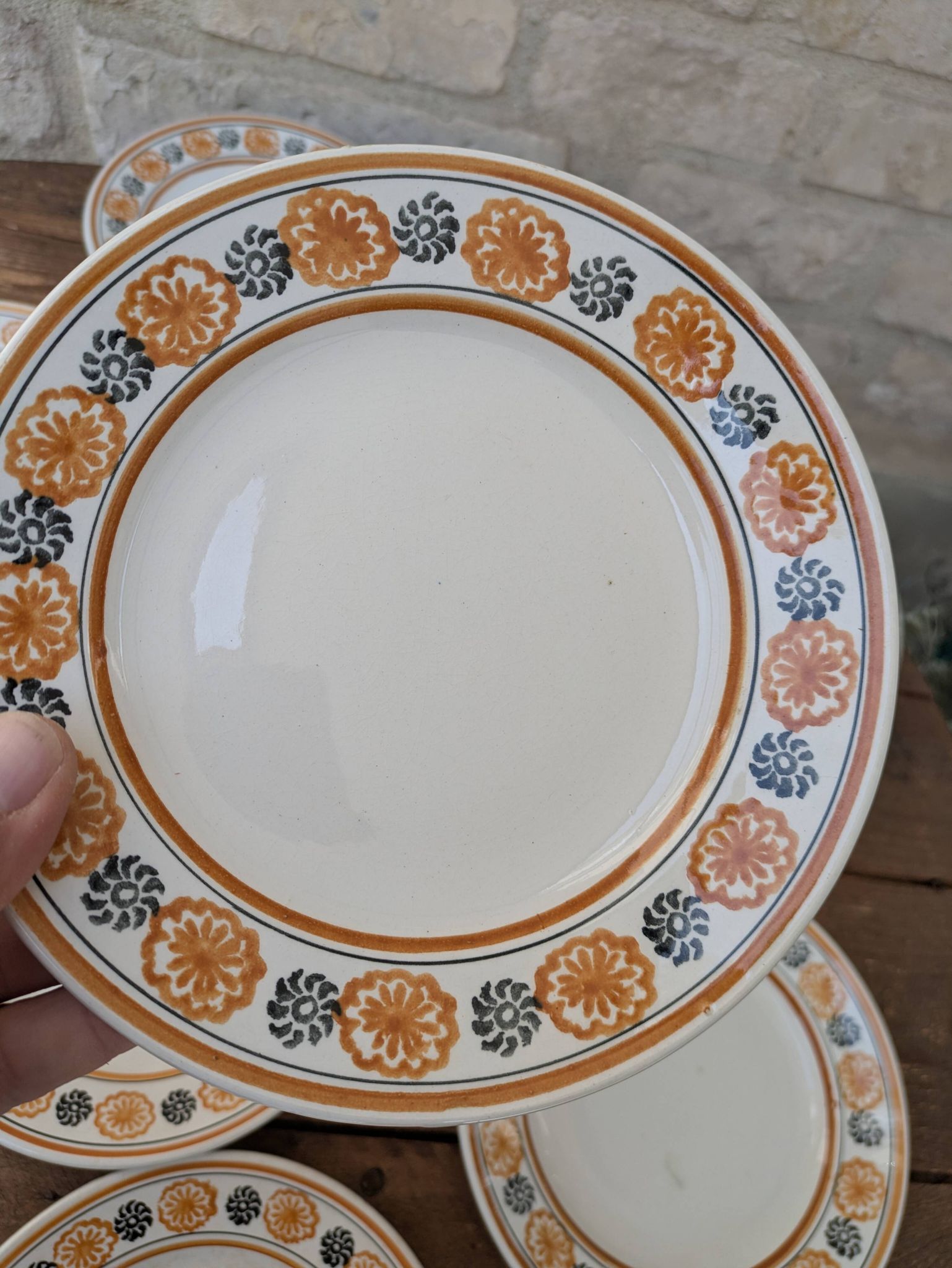 10 dessert plates Saint Amand Amandinoise frilled with orange and black flowers.