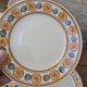 10 dessert plates Saint Amand Amandinoise frilled with orange and black flowers.